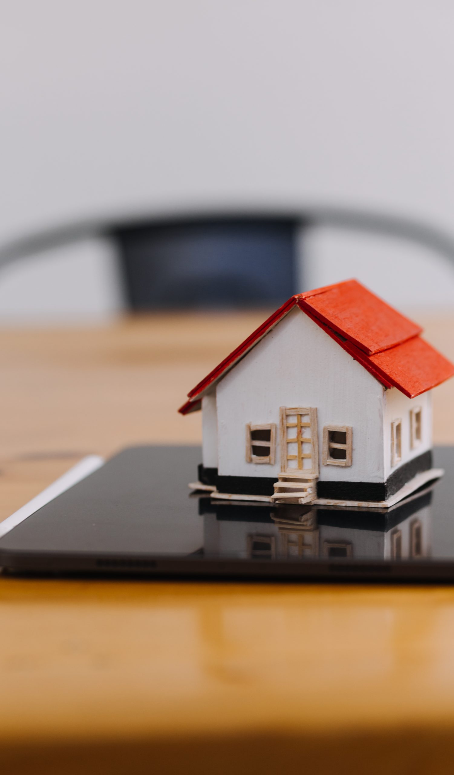 Discussion with a real estate agent, House model with agent and customer discussing for the contract to buy, get insurance or loan real estate or property.